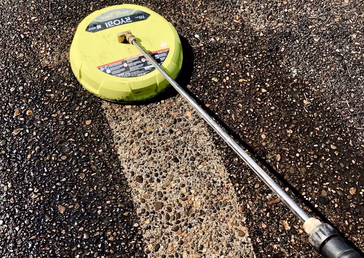 Surface cleaner removing buildup from concrete